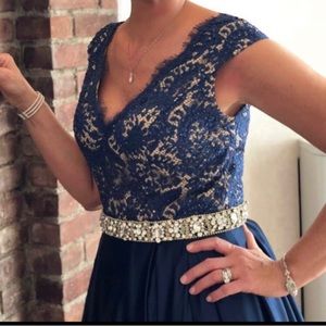 Stunning navy Jovani satin gown with hidden pockets and in excellent condition.